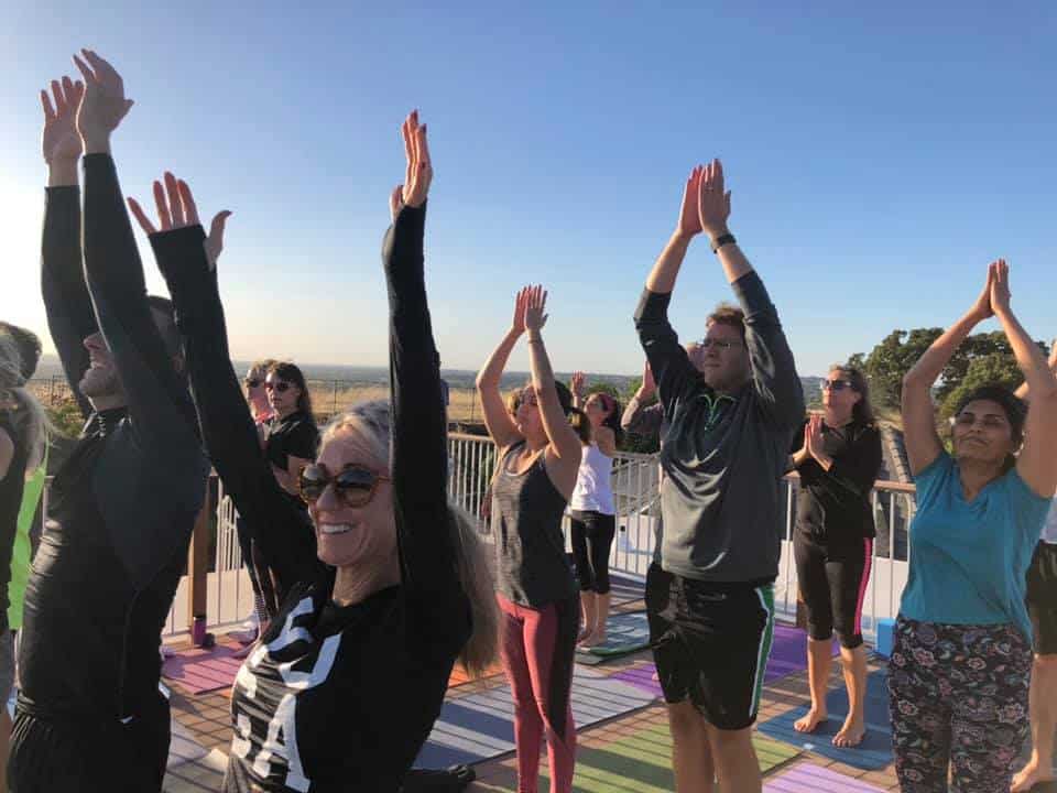 Asim organizes a rooftop yoga event
