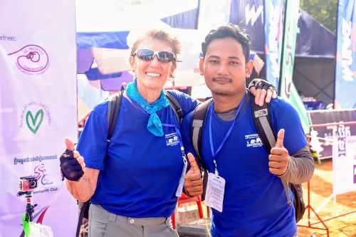 Pat cycles at Angkor Wat with Scholarship Student, Borey
